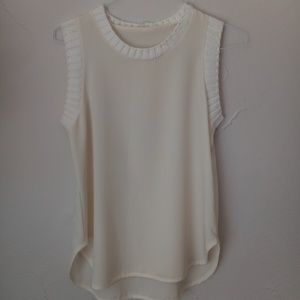 Cream sleaveless blouse